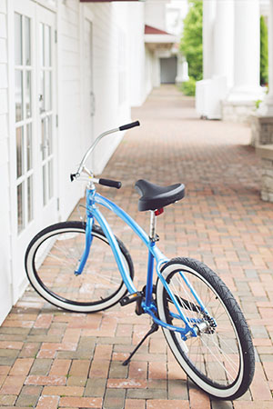 Blue beach cruiser bicycle, brick pathway, Inn at Bay Harbor