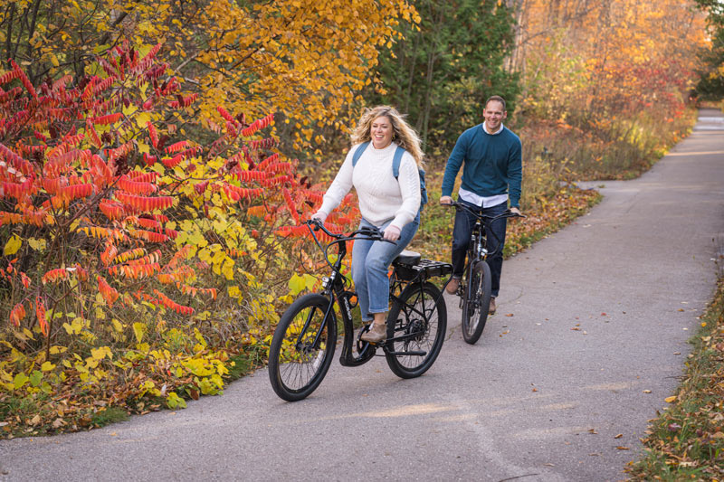 Couple rides Pedego e-bikes bikes, autumn