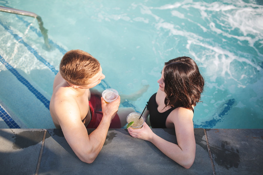 Couple enjoys cocktails in hot tub