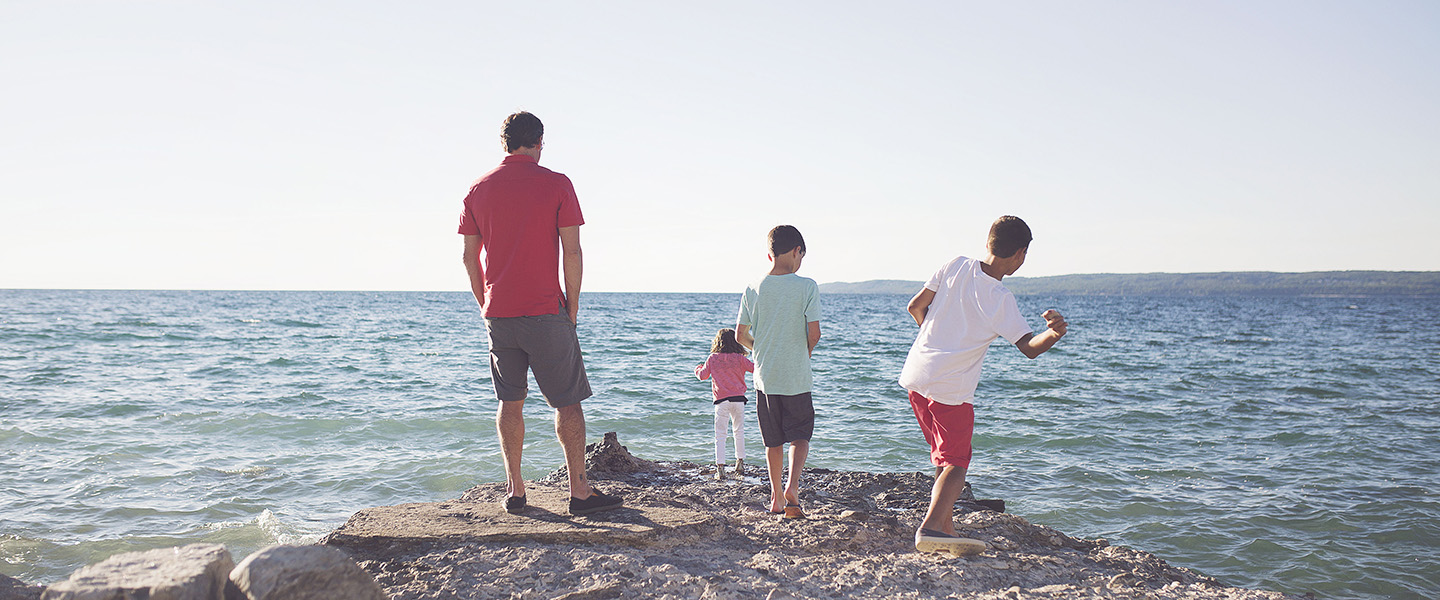Kids with dad on Lake Michigan